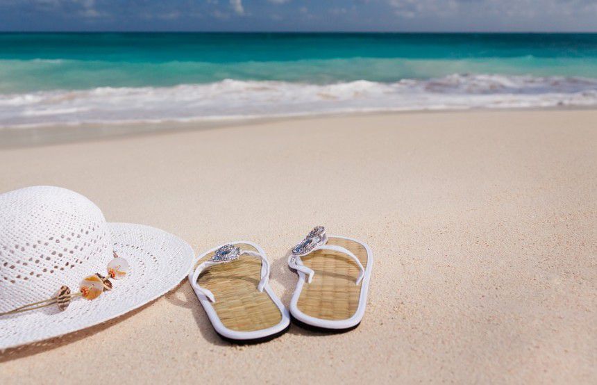 female slippers and cap on a beach