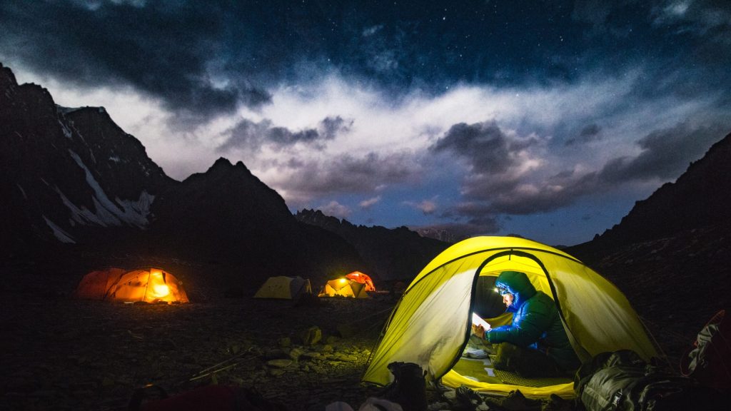 a-man-in-blue-jacket-in-a-dome-tent