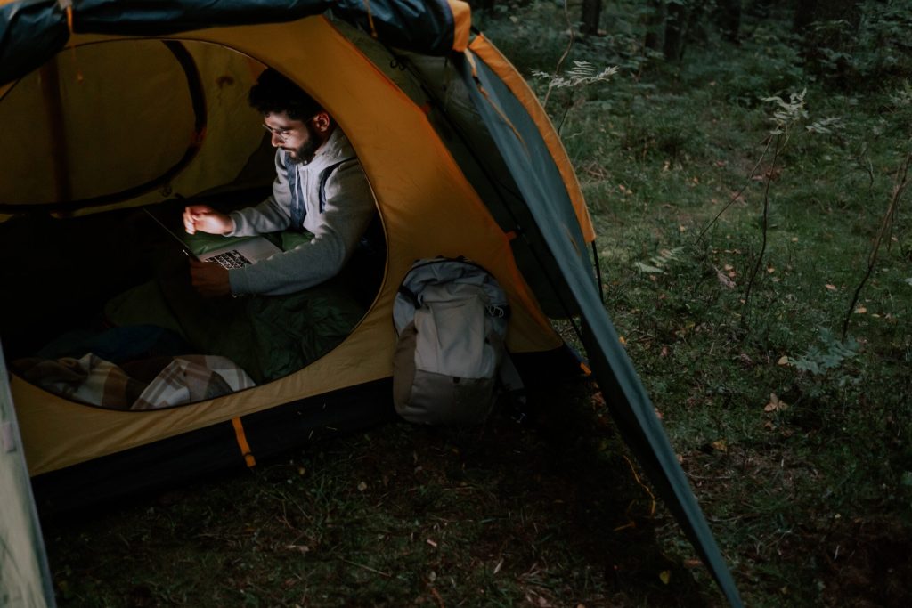 man-sitting-inside-a-tent