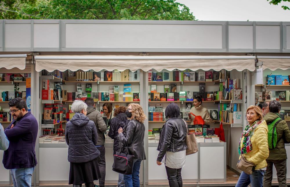 People standing in front of a book shop